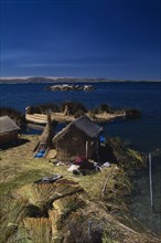 PERU, Puno, Lake Titicaca, Reed houses on floating islands built by the Uros people.