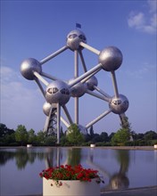 BELGIUM, Brabant, Brussels, The Atomium.  Vast structure of connecting metal spheres reflected in