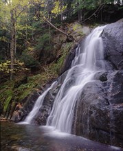 USA, Vermont, Green Mountain National Park, Moss Glen Falls.  Waterfall over steep rockface in