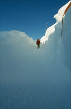 ANTARCTICA, South Pole, "US Amundsen-Scott South Pole Station.  Figure walking through entrance way