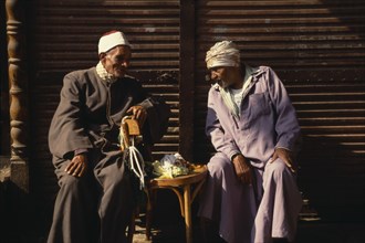 EGYPT, Cairo, "Two old Muslim men seated, in conversation."