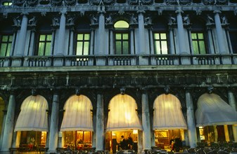 ITALY, Veneto, Venice, "Piazetta San Marco.  Café at night, detail of facade showing balcony,