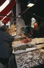 ITALY, Veneto, Venice, Stalls at the Rialto fish market.