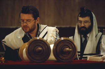 SOCIETY, Religion, Judaism, Two Rabbis saying Mincka prayers in front of Torah scrolls inside
