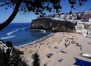 PORTUGAL, Algarve, Carvoeiro, View over the beach in the fishing cove.