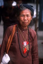 VIETNAM, Hanoi, "Elderly woman, three quarter shot."