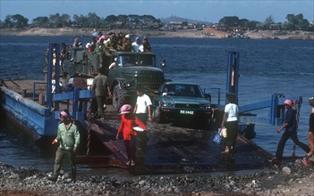 CAMBODIA, Phnom Pehn, "Motor ferry from Phnom Pehn to Kampong Cham with truck , car and foot