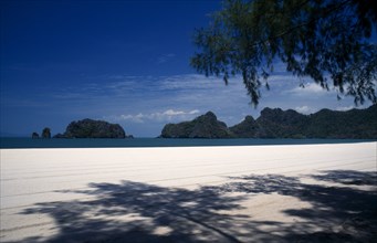 MALAYSIA, Kedah, Langkawi, Pantai Rhu beach looking out to the offshore islands from beneath