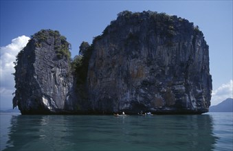 MALAYSIA, Kedah, Langkawi, Fishermen in boats beside one of the many small islands off the south