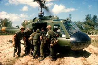 VIETNAM, War, Booby trap marine dust off North of Tam Ky.  Wounded soldier being lifted into