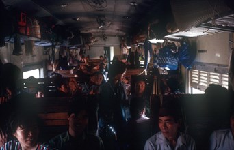 VIETNAM, Transport, The crowded interior of a third class train compartment travelling from Nhetang