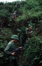 VIETNAM, Cao Bang Province, Pac Bo, Soldiers on a training exercise.  View up hillside along