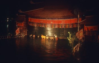 VIETNAM, Hanoi, Water puppet theatre on Petit Lake at night.