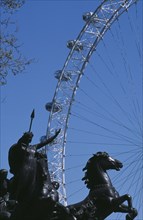 ENGLAND, London, Part view of the statue of Bodicea with the British Airways London Eye behind.