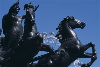 ENGLAND, London, Part view of the statue of Bodicea with the British Aiways London Eye just seen