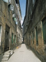 TANZANIA, Zanzibar Island, Zanzibar, "Stone Town.  Quiet, narrow street lined with houses with