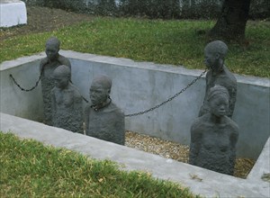 TANZANIA, Zanzibar Island, Zanzibar, Stone Town. Sculpture depicting five slaves chained in a pit