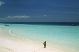 TANZANIA, Zanzibar Island, "Nungwi.  View along beach with white sand and aquamarine sea, towards