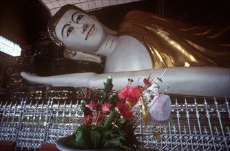 MYANMAR, Pegu, Shwethalyaung reclining Buddha.  Part view of head and arm.