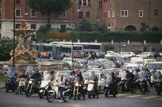 ITALY, Lazio, Rome, Busy road with lines of waiting cars and scooters.