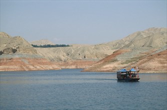 CHINA, Gansu Province, Yellow River, Linjiaxia Reservoir  with ferry