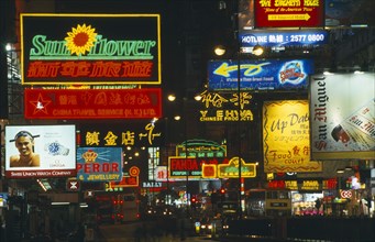 HONG KONG, Markets, Streets, Busy street with traffic and pedestrians with neon signs and