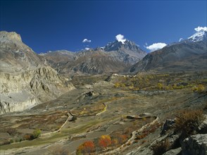 NEPAL, Annapurna Region, Jharkot, View over Jhong Khola Valley and the Thorung La pass to distant