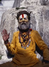 NEPAL, Kathmandu, "Hindu sadhu, follower of Shiva wearing saffron coloured  clothing and with