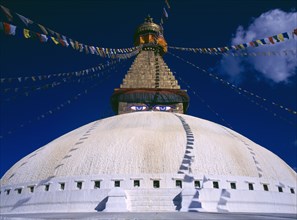 NEPAL, Kathmandu, Bodhnath stupa hung with prayer flags.