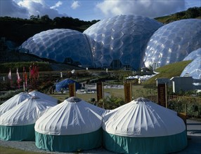 ENGLAND, Cornwall, St. Austell, Eden Project.  General view over the Humid Tropics Biome exterior