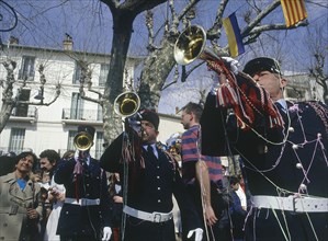 FRANCE, Cote d’Azur, Alpes Maritime, Gendarmes playing trumpets in a square in Vence during  the
