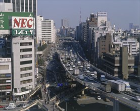 JAPAN , Honshu, Tokyo, Shibuya District City view with elevated motorway and busy traffic