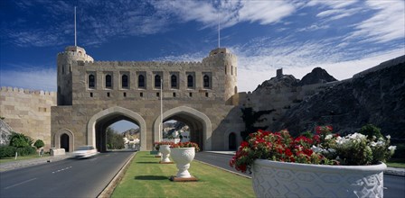 OMAN, Muscat, "Muscat Gate Museum,  Crenellated gatehouse with archways over roads divided by