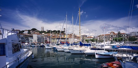 FRANCE, Provence-Cote d’Azur, Cannes, "The Old Port, view over moored boats towards waterside