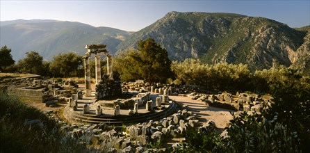 GREECE, Central Greece, Delphi, Sanctuary of Athena.  View over ruins in mountain landscape.