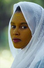 ETHIOPIA, Harerge Province, General, Portrait of young woman in white head covering with face