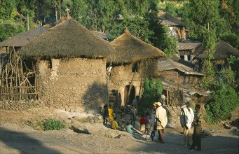 ETHIOPIA, Wolo Province, Lalibela, "Two storey, circular stone buildings with thatched rooftops,