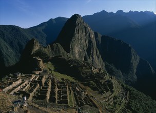 PERU, Cusco Department, Machu Picchu, View of the hilltop ruins and the mountains beyond
