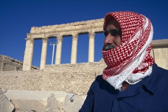 SYRIA, Central, Tadmur, "Custodian to the Sanctuary of Bel in traditional red and white checked