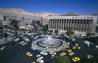 SYRIA, South, Damascus, View over Tajrida Al Maghribiya Square with traffic encircling a central