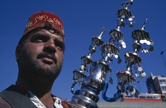 SYRIA, South , Damascus, "Drink vendor, cropped view with decorative water container."