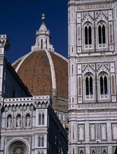 ITALY, Tuscany, Florence, The Duomo.  Part view of the dome seen between the Campanile and facade