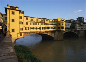 ITALY, Tuscany, Florence, "Ponte Vecchio in warm, golden light."