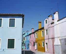ITALY, Veneto, Venice, Burano Island.  Row of brightly painted houses.