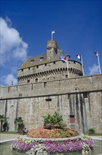 FRANCE, Brittany, Ille et Vilaine, "St. Malo.  Chateau Gaillard, exterior with flags flying from