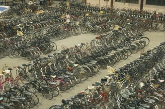 CHINA, Henan, Kaifeng, Massed cycles in bicycle park