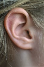 HEALTH, Hearing, Close view of the ear of a seven year old girl.