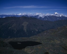 BHUTAN, Simkota Tsho, "View from above towards mountain peak of Jitchu Drakey 6989 metres above sea