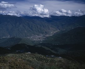 BHUTAN, Thimphu, "View from above across city, valley and surrounding mountains."