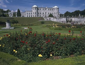 IRELAND, County Wicklow, Powerscourt House, View over formal gardens towards exterior facade.